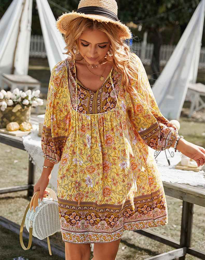 Women's short dress with a notched neckline, long sleeves and a gathered waist