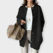 Women's long cardigan with a round neckline, a button front and a longline silhouette