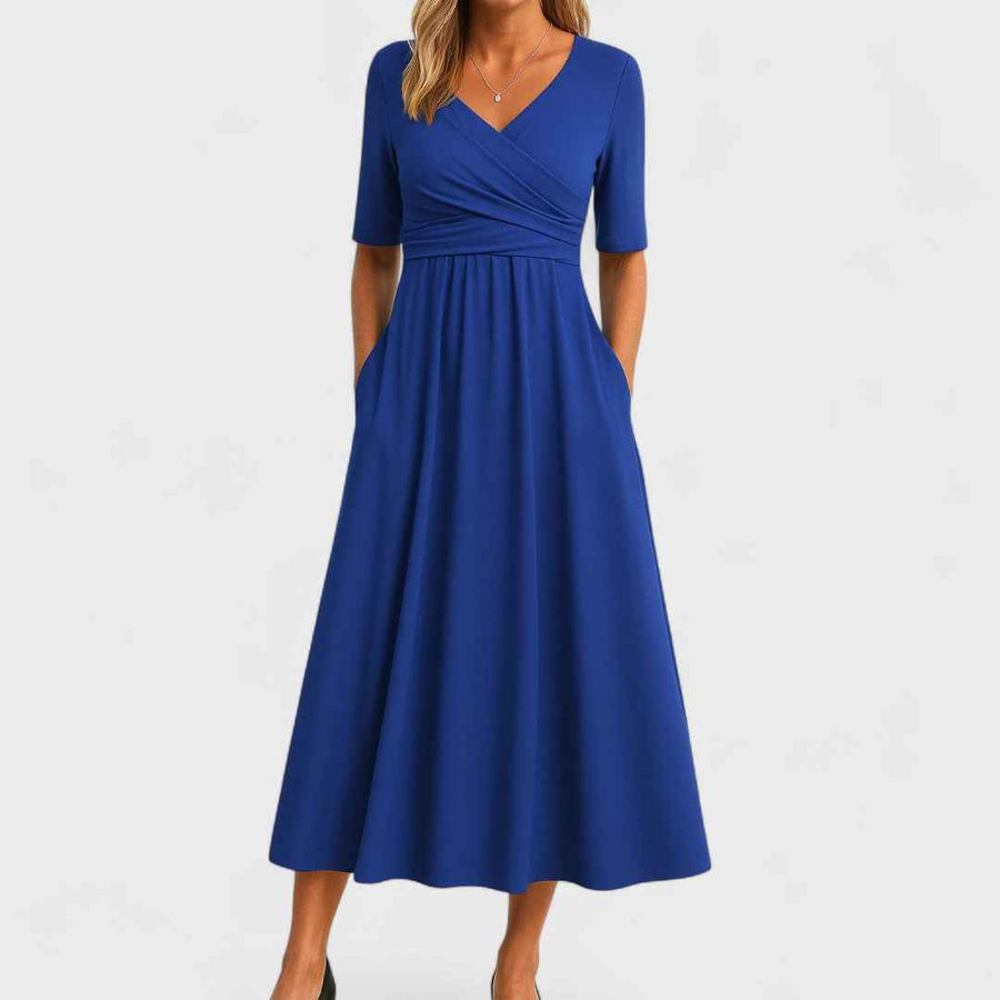 Women's midi dress with a wrap-style front, elbow-length sleeves and a defined waist