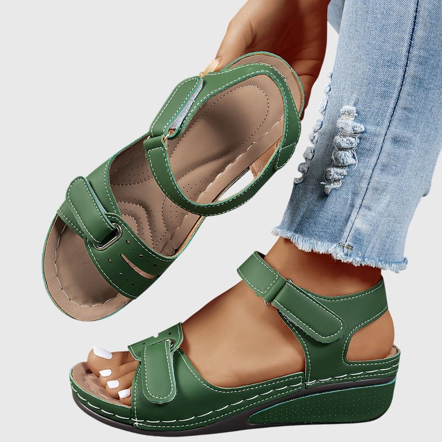 Women's wedge sandals with two broad straps, an ankle strap and an open toe