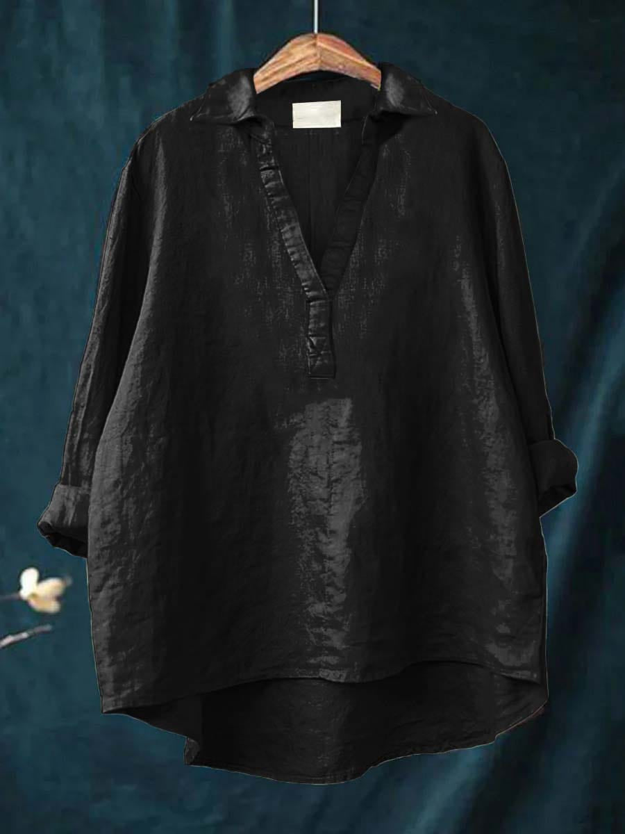 Women's blouse with a V-shaped neckline, a ruffled placket and a curved hem