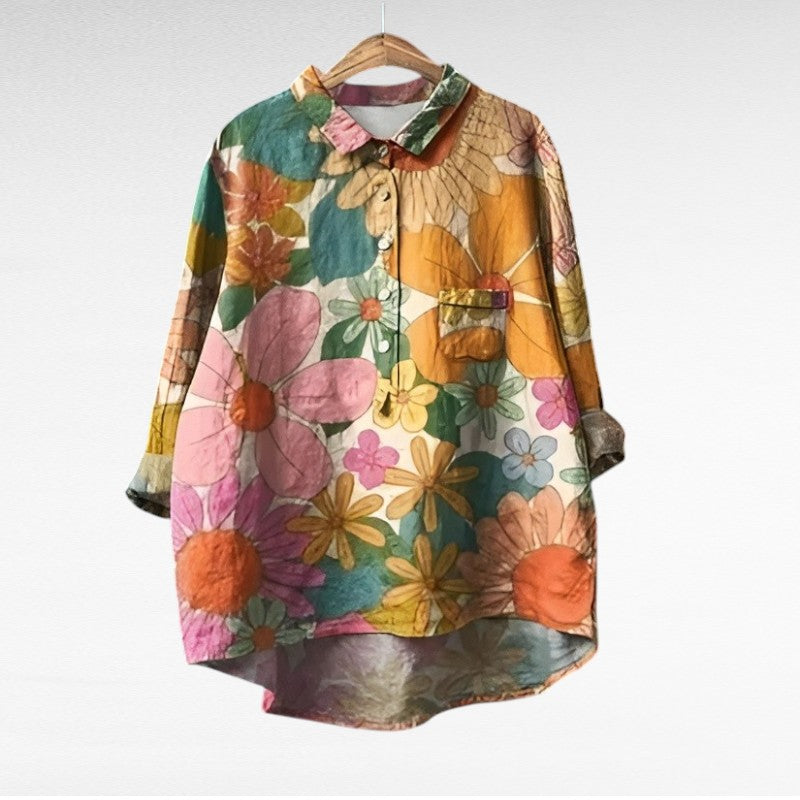 Women's blouse with a pointed collar, a button front and turned-up sleeves