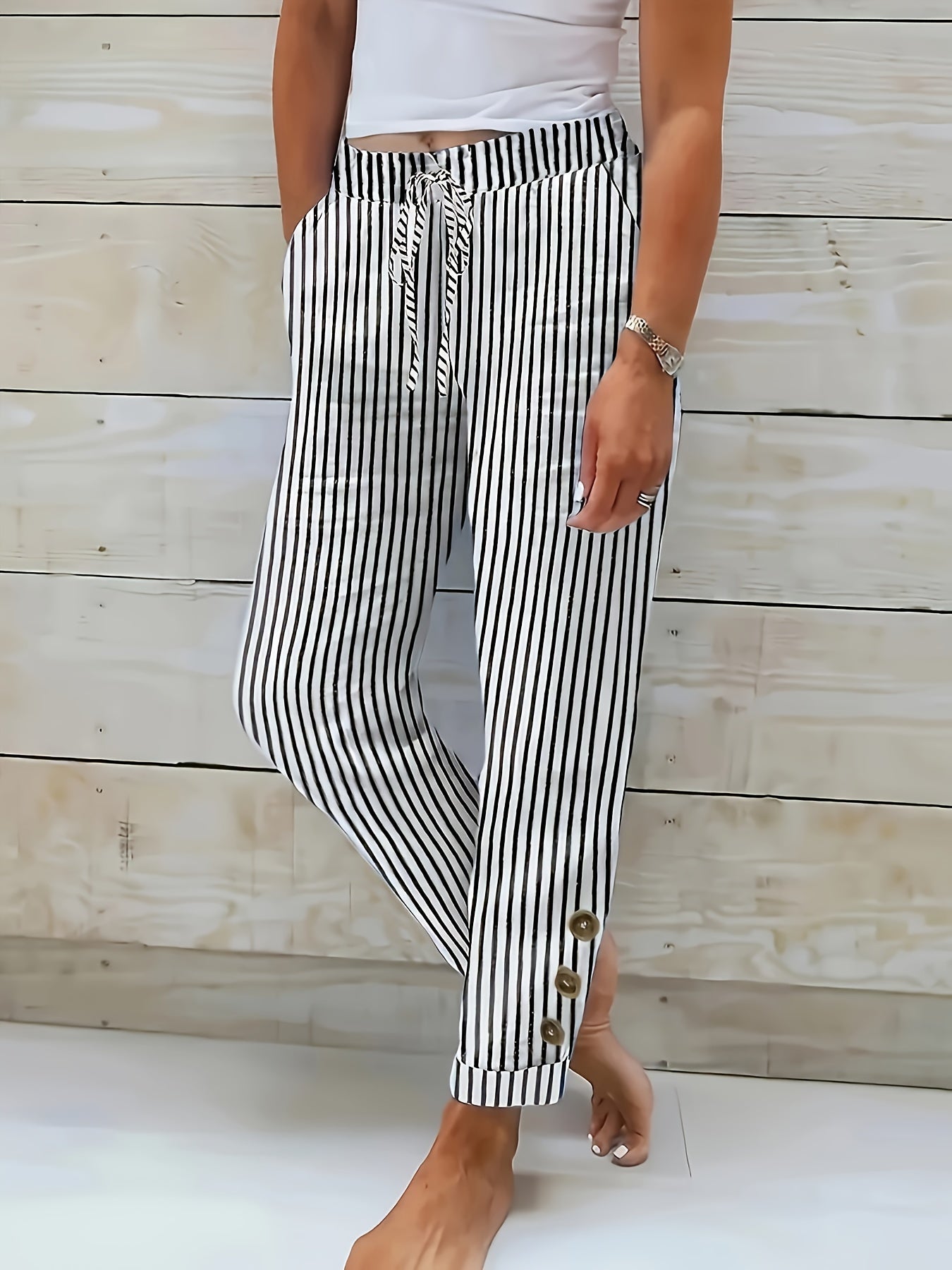 RAQUELLE | STRIPED RELAXED-FIT TROUSERS