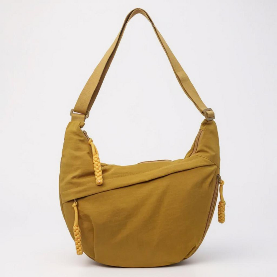 Ochre crescent shoulder bag with zip pockets, front product view.