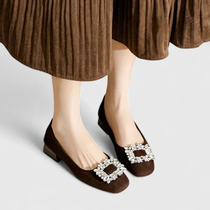 Women's heels with decorative embellishment, a closed toe and a low heel