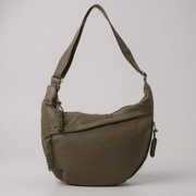 Olive green crescent shoulder bag with zip pockets, front product view.
