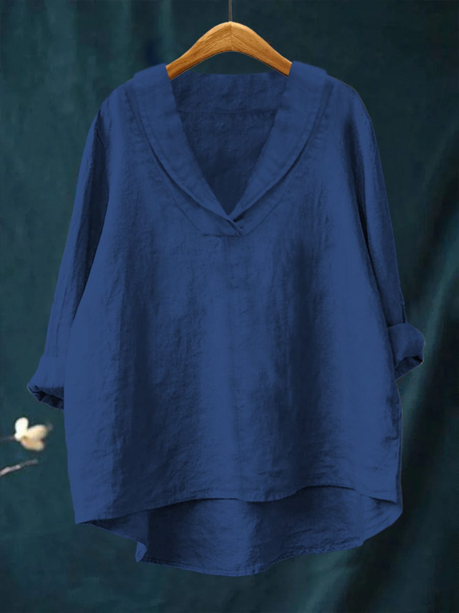 Women's blouse with a pointed collar, a V-shaped neckline and turned-up sleeves