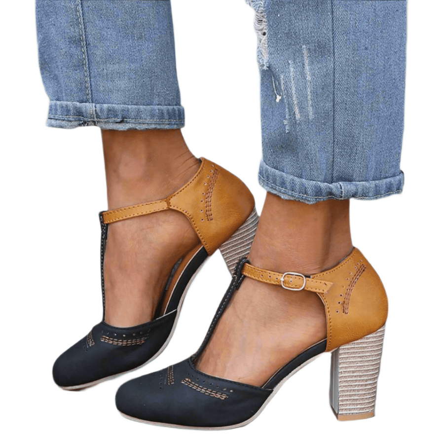 Women's heels with a T-shaped strap, a rounded toe and a closed toe