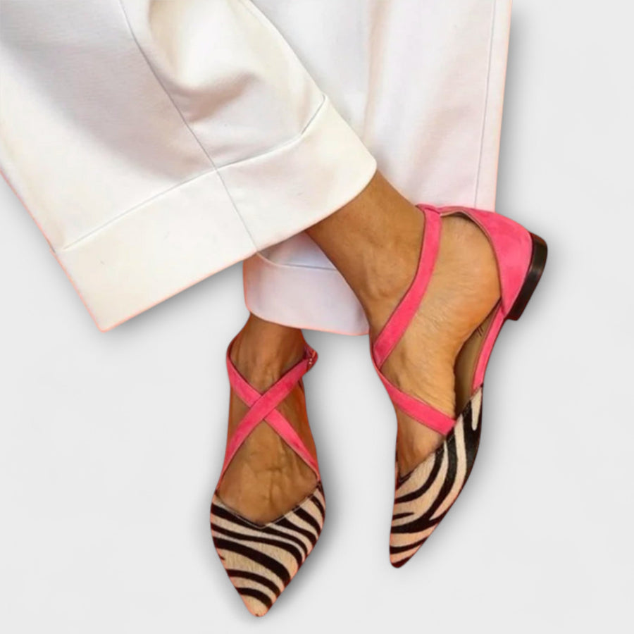 Women's heels with a zebra print, crossing straps and a slingback strap