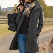 Women's coat with a stand collar, a button front and side pockets