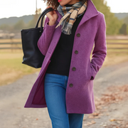 Women's coat with a stand collar, a button front and side pockets