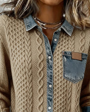 Close-up of the cable-knit cardigan collar, button placket and contrast chest pocket.