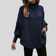 Cable-Knit Roll-Neck Poncho, front view.