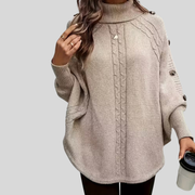Cable-Knit Roll-Neck Poncho, angled front view.