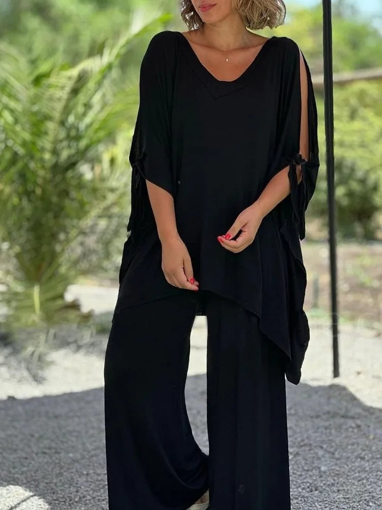 Women's trouser set with cut-out detailing, a scoop neckline and elbow-length sleeves