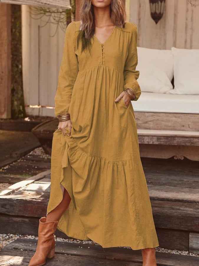 Women's midi dress with a notched neckline, elbow-length sleeves and a tiered skirt