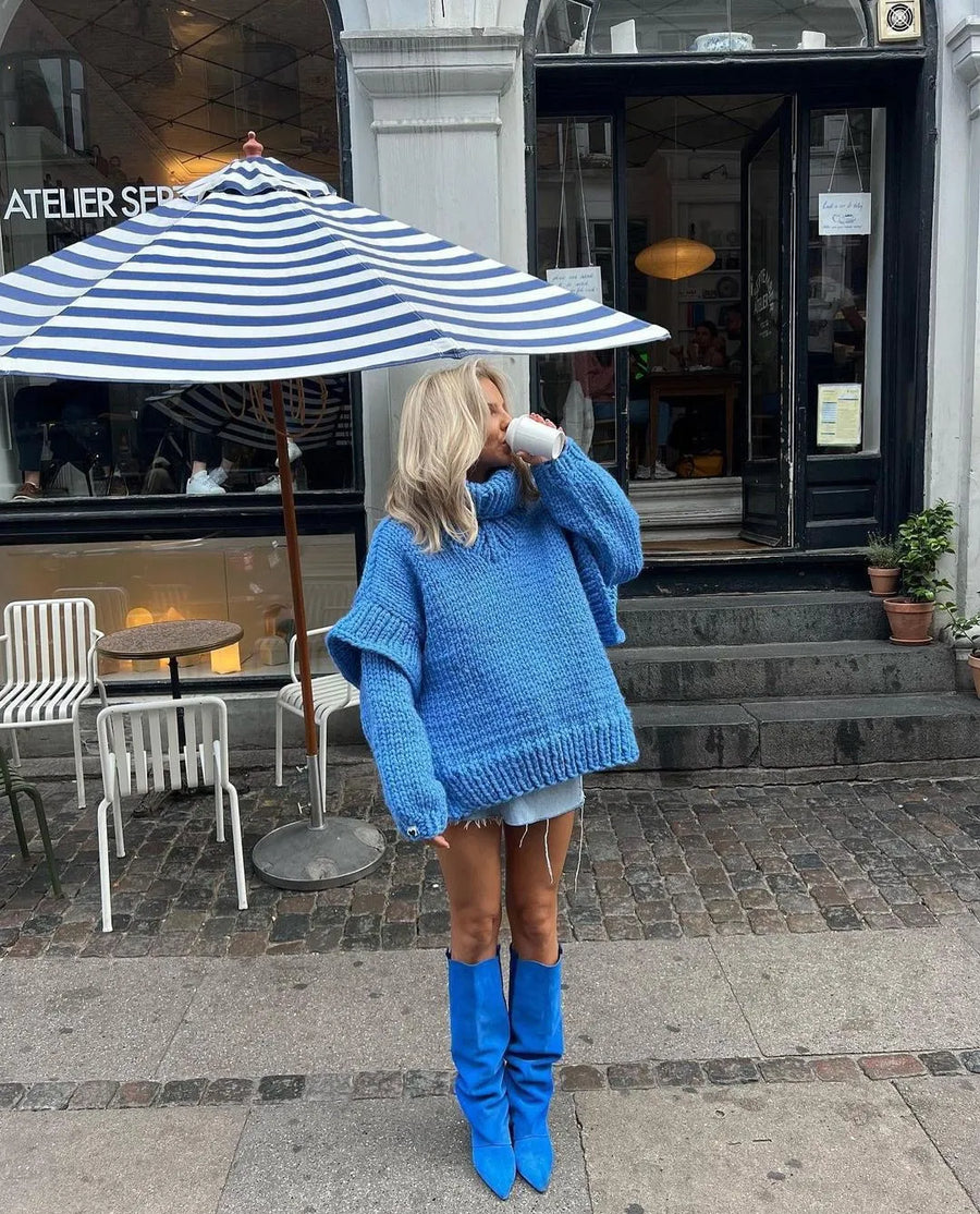 Women's jumper with a chunky knit texture, a roll neckline and dropped shoulders