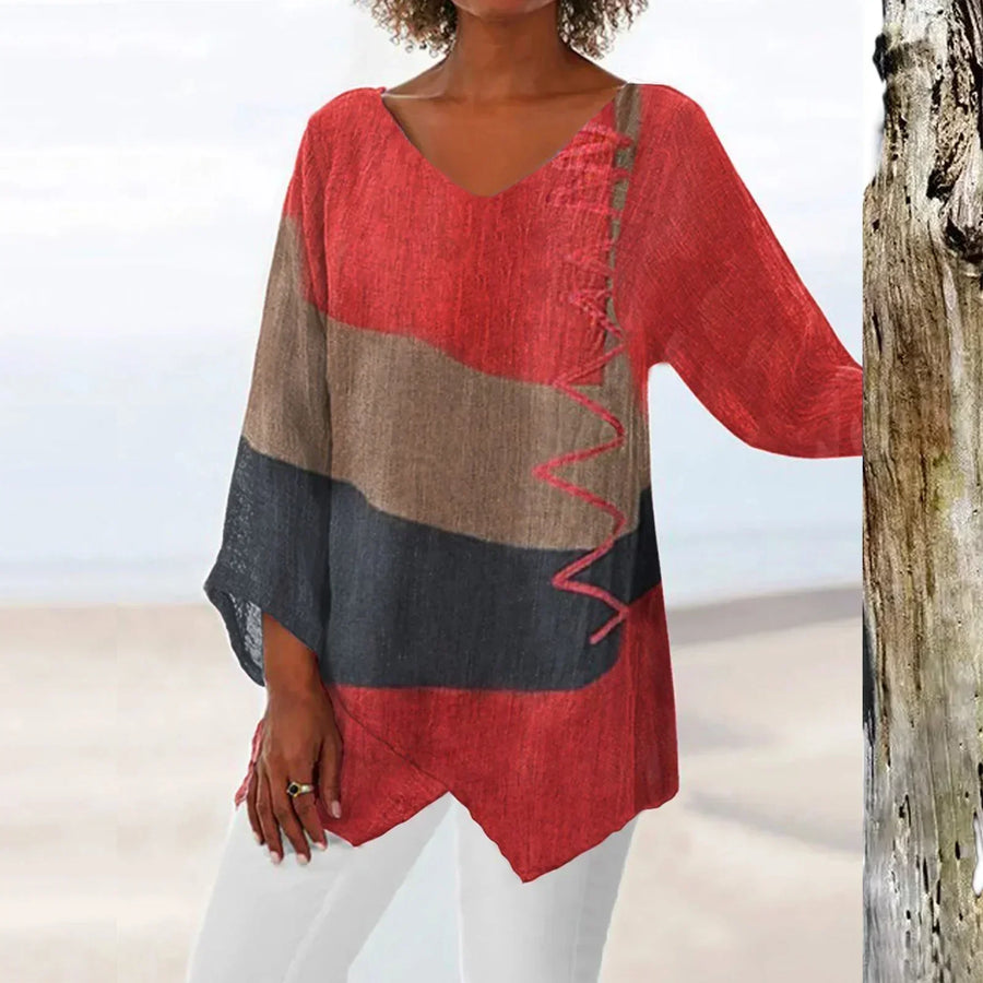 Women's tunic with a V-shaped neckline, an asymmetric hem and elbow-length sleeves