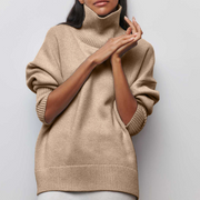 Women's jumper with a roll neckline, elbow-length sleeves and a ribbed hem