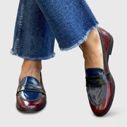 Women's loafers with contrasting panels, a penny-style strap and a rounded toe