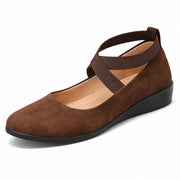 Women's wedge heels with crossing straps, a closed toe and a wedge heel