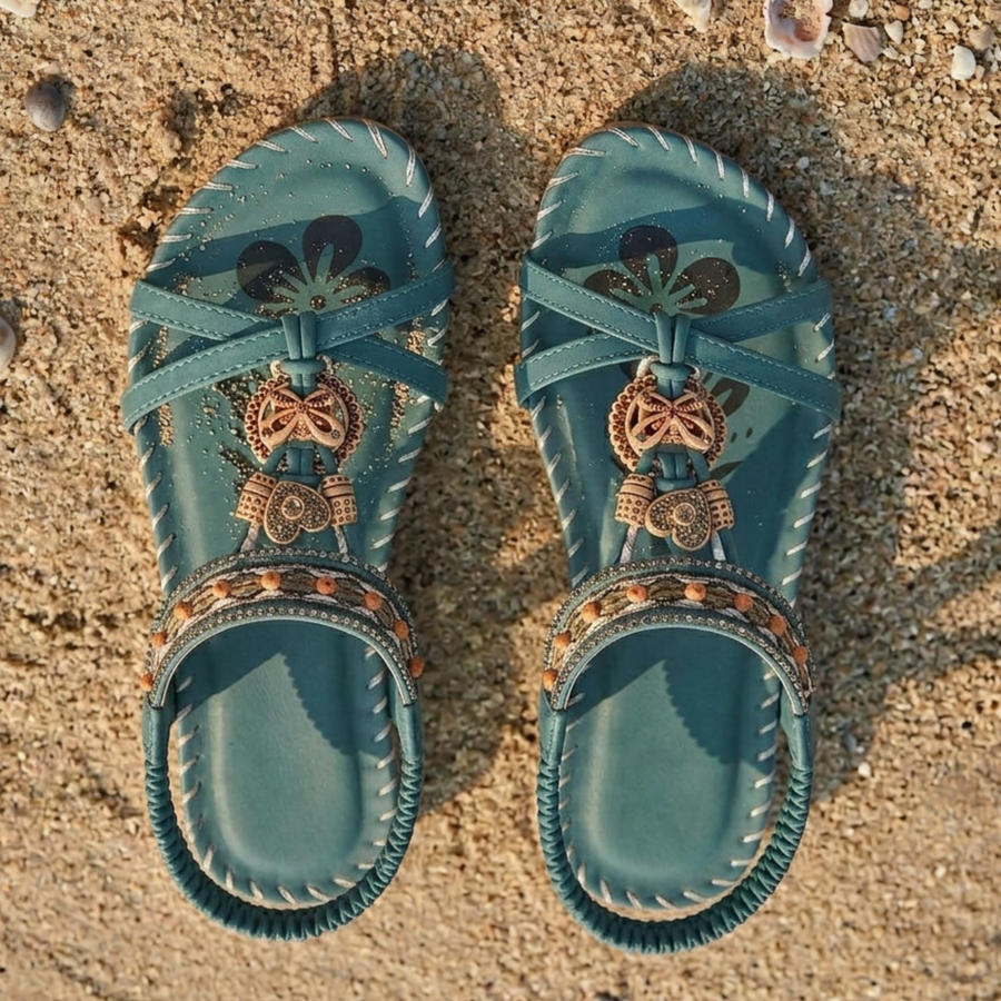 Women's sandals with a T-shaped strap, decorative embellishment and an open toe