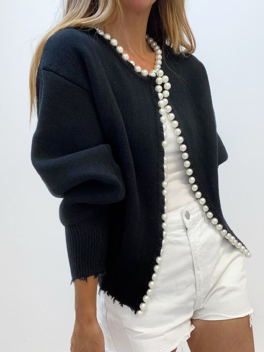 Women's cardigan with decorative trim, a button front and long sleeves