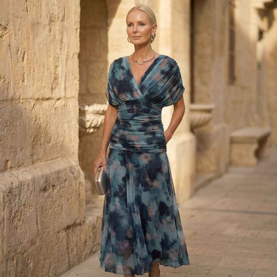 Women's midi dress with an abstract print, a wrap-style front and short sleeves