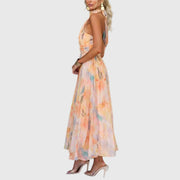 Women's maxi dress with a halterneck design, pleated detailing and a defined waist