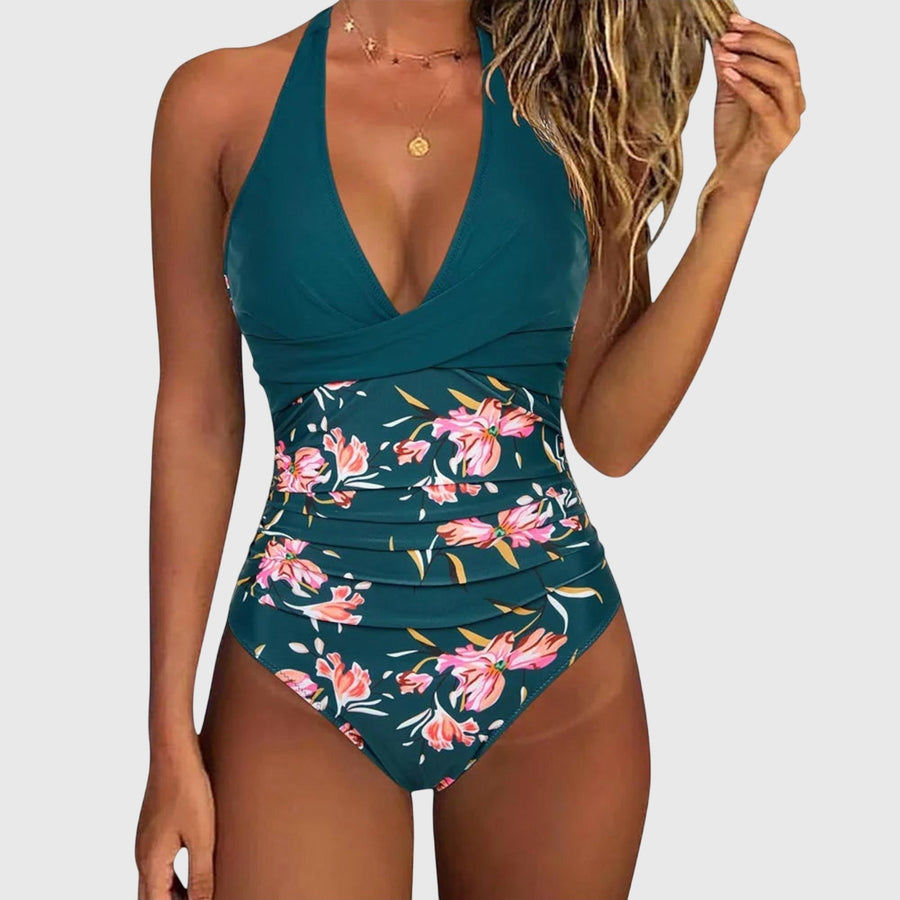 Women's one-piece swimsuit with a floral pattern, a halterneck design and a V-shaped neckline