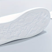 Women's trainers with a panelled upper, a lace-up fastening and a rounded toe