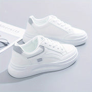 Women's trainers with a panelled upper, a lace-up fastening and a rounded toe
