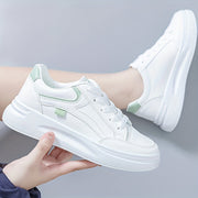 Women's trainers with a panelled upper, a lace-up fastening and a rounded toe