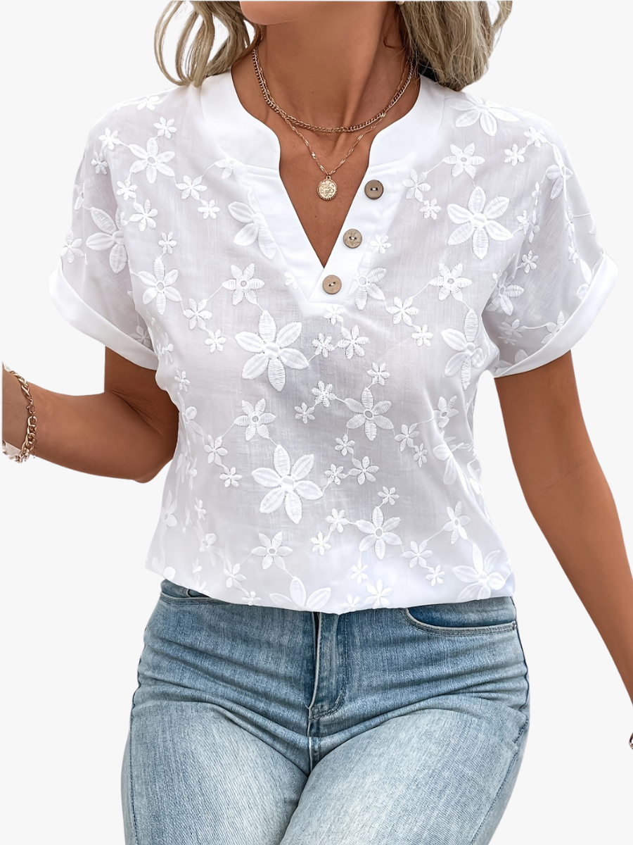 Women's blouse with a floral pattern, a button neckline and short sleeves