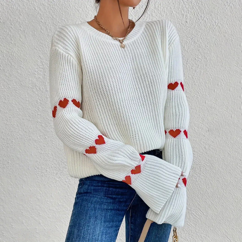 Women's jumper with heart motifs on the sleeves, a ribbed texture and a round neckline