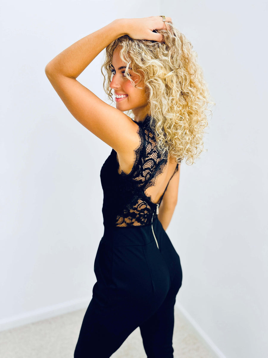 Women's jumpsuit with a sheer inset panel, a high neckline and a sleeveless shape