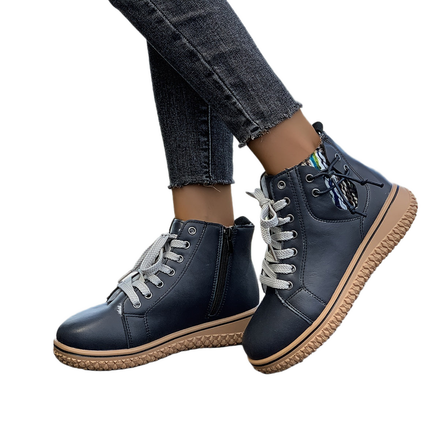 Women's ankle boots with a lace-up fastening, a zipped shaft and a rounded toe