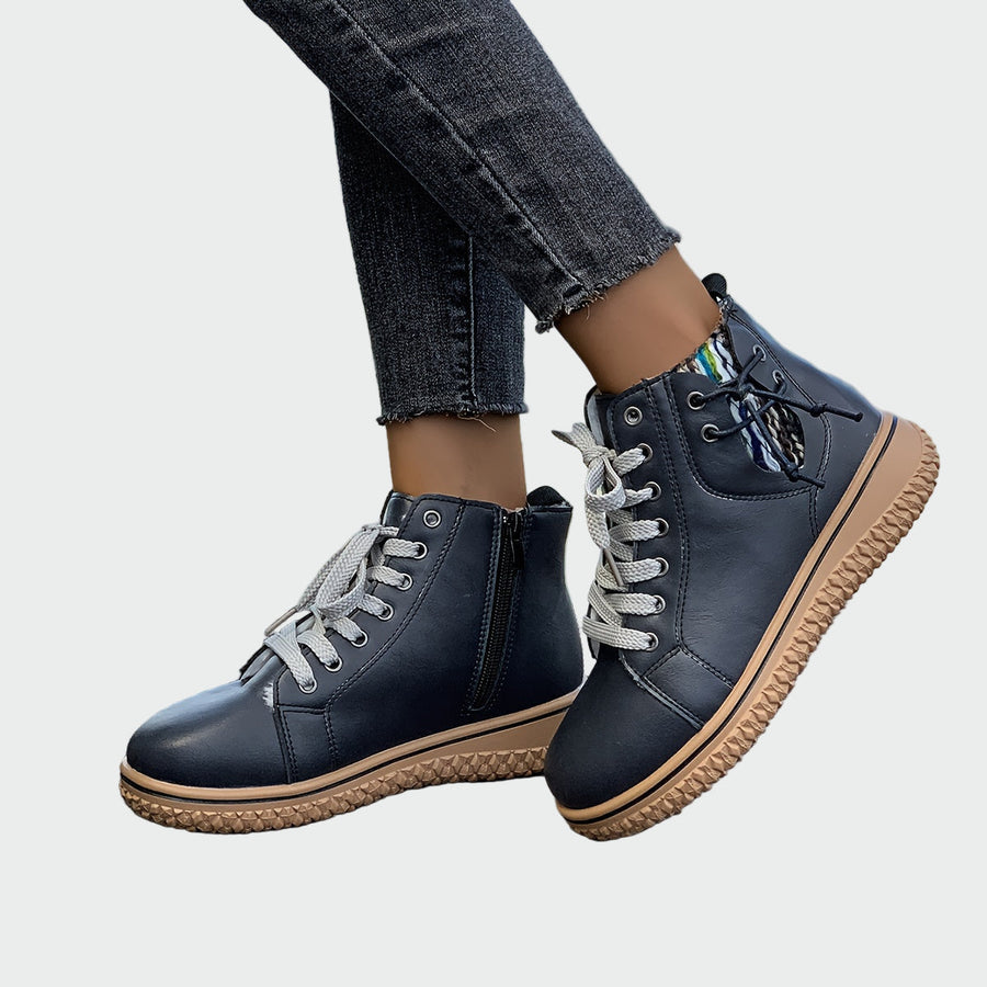 Women's ankle boots with a lace-up fastening, a zipped shaft and a rounded toe