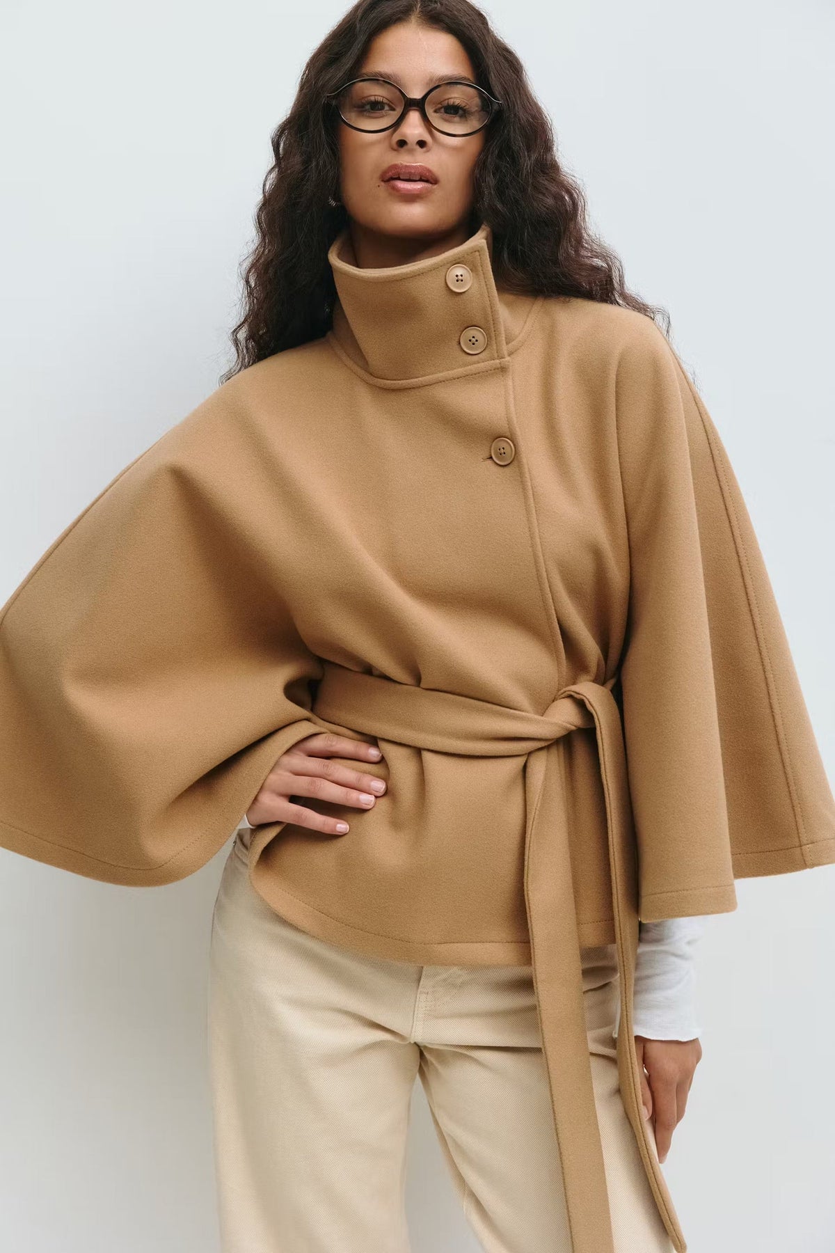 Women's cape with a stand collar, a waist belt and wide sleeves