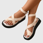 Women's platform sandals with crossing straps, an ankle strap and a platform sole