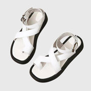Women's platform sandals with crossing straps, an ankle strap and a platform sole