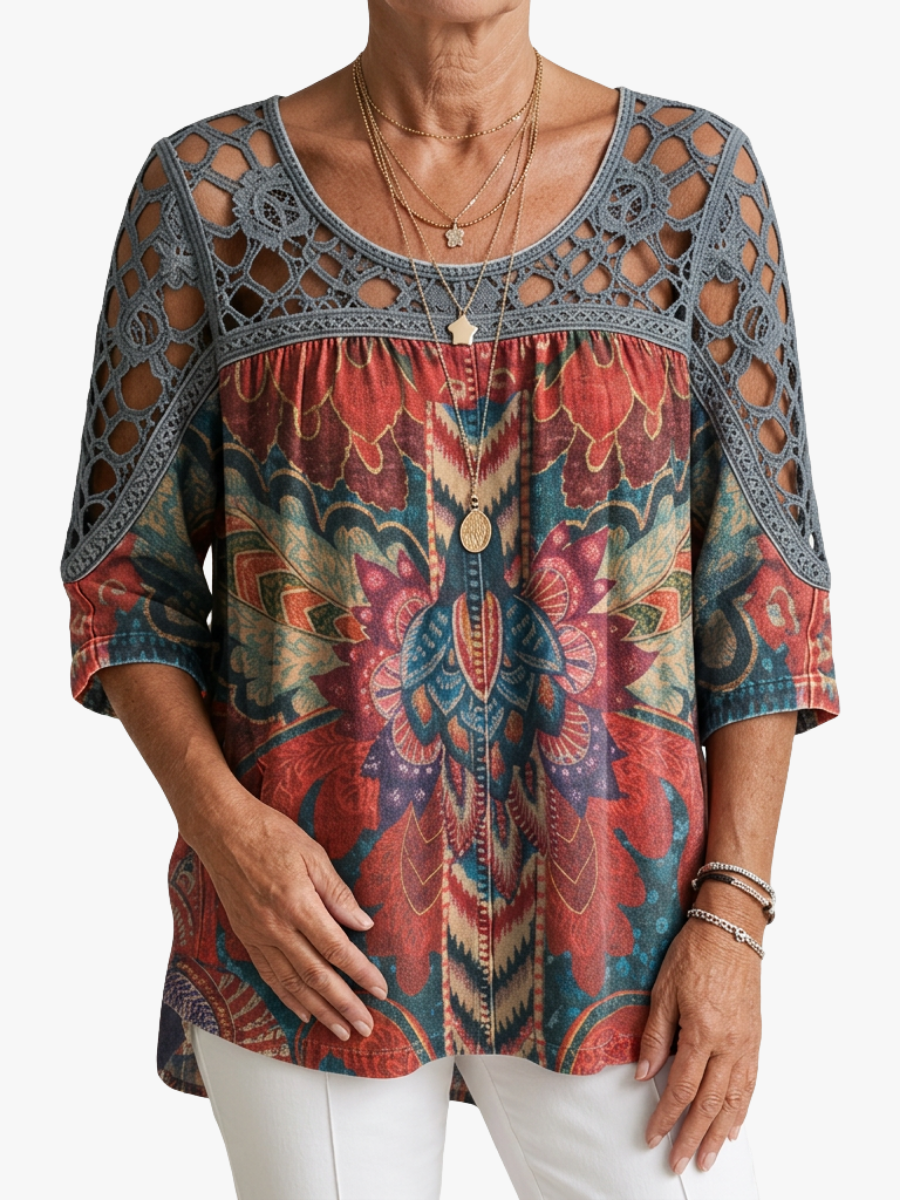 Women's blouse with an ornamental pattern, a lace yoke and elbow-length sleeves