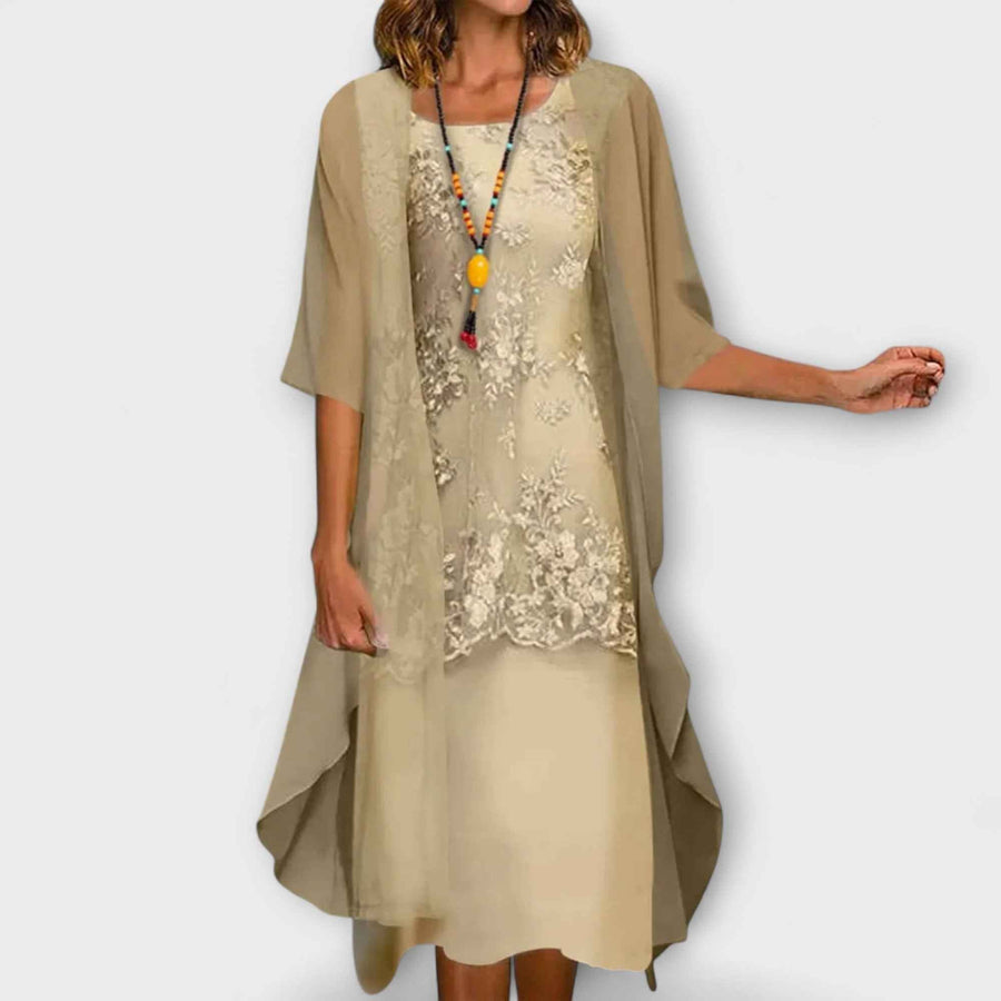 Women's midi dress with lace panels, a round neckline and elbow-length sleeves