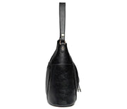 Women's handbag with a shoulder strap, a front zip and a curved outline