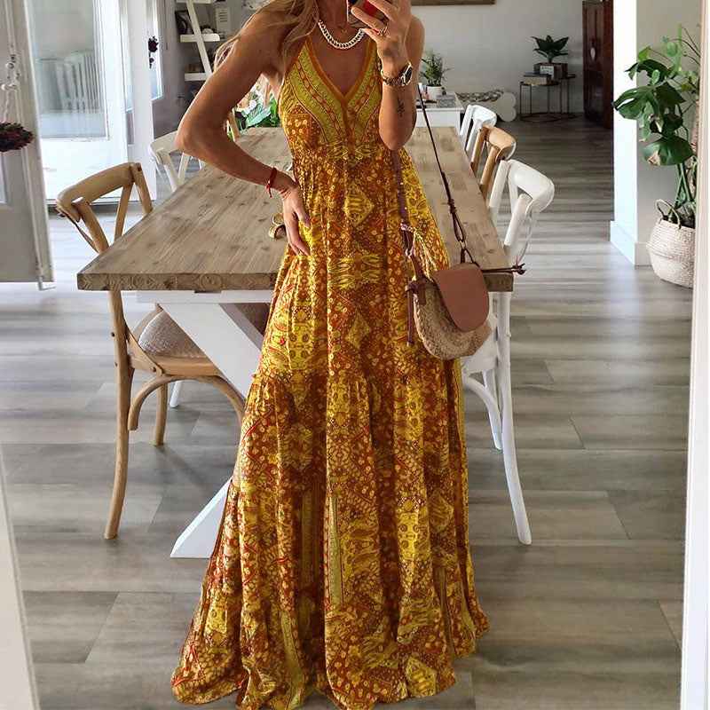 Women's maxi dress with thin shoulder straps, a V-shaped neckline and a tiered skirt