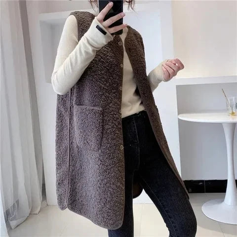Women's long knitted gilet with a sleeveless shape, a longline silhouette and a button front