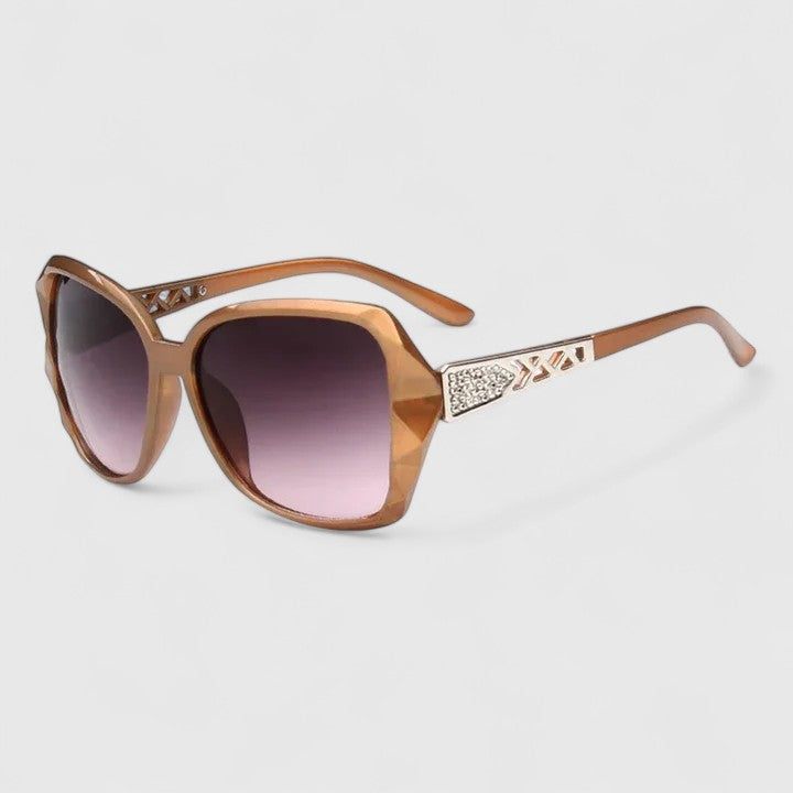 Women's sunglasses with a cat-eye frame, decorative embellishment and a full-rim design