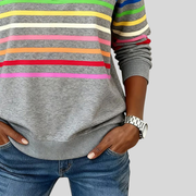 Horizontal stripes across the sweatshirt body and sleeves, with the curved lower hem visible.