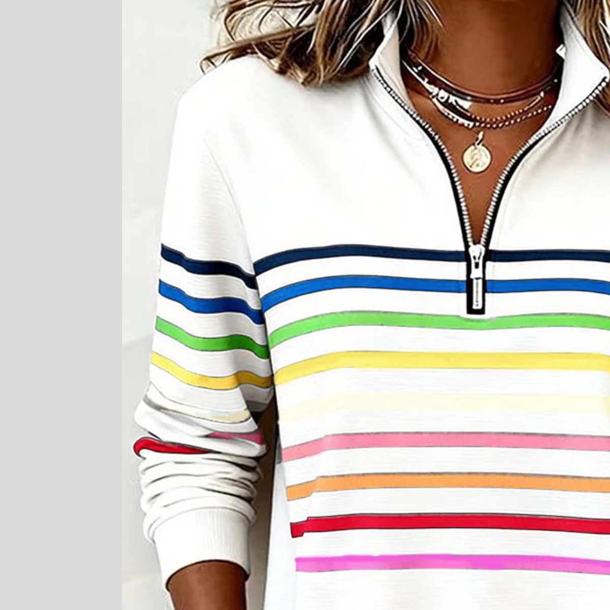 Stand collar and short neckline zip above horizontal chest stripes on the sweatshirt.