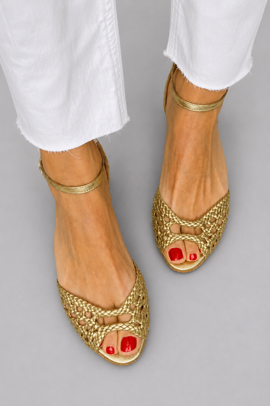Women's heeled sandals with a peep toe, an ankle strap and decorative embellishment